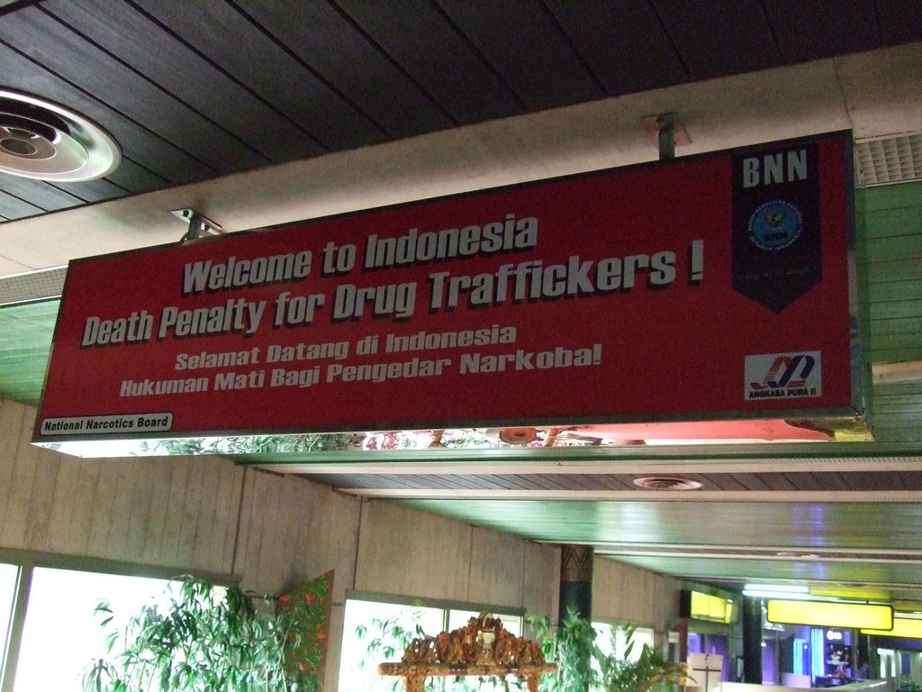 A sign at the international airport of Indonesia reads: “Welcome. Death penalty for drug traffickers”