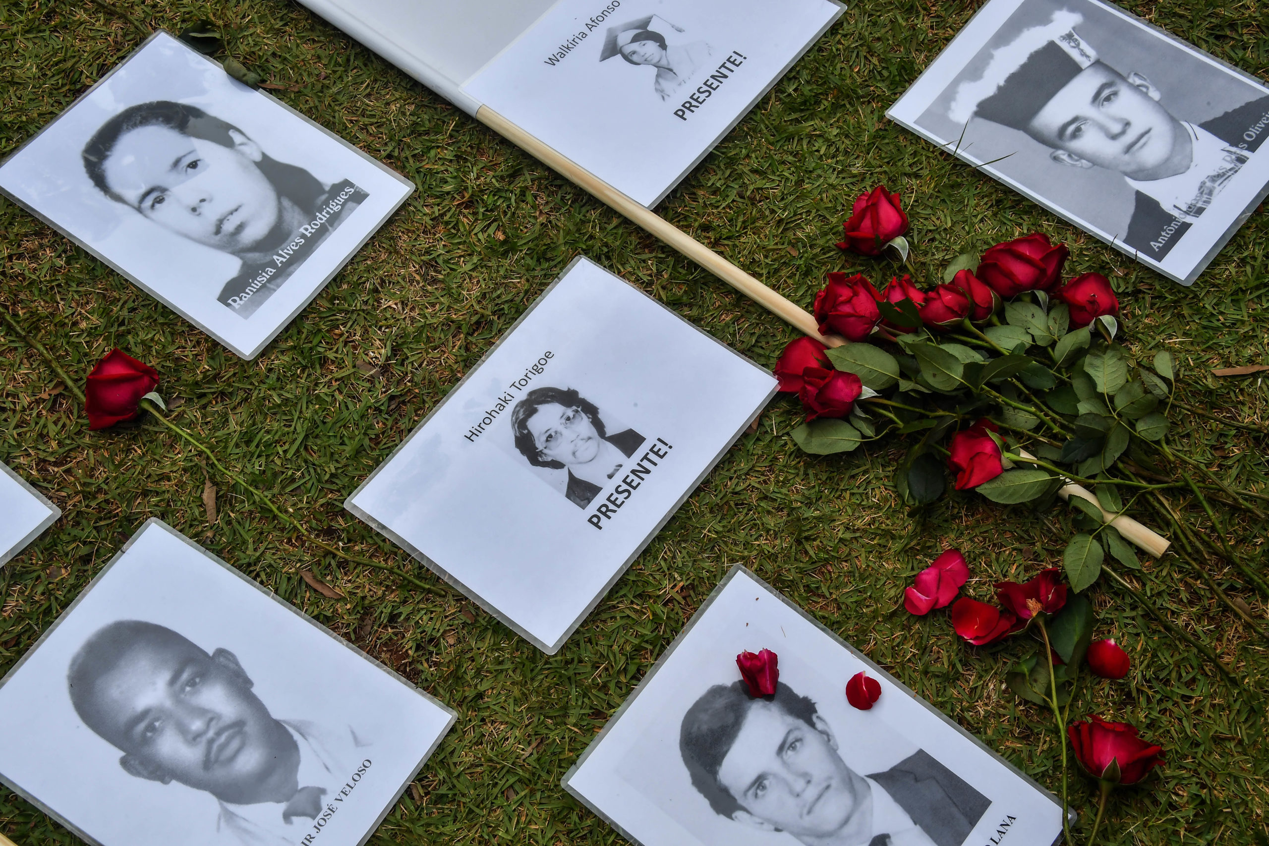 Portraits of persons who were killed or went missing during the 1964-1985 dictatorship are displayed during a demonstration on the 55th anniversary of the military coup, at Ibirapuera Park, in Sao Paulo, Brazil, on March 31, 2019. - Thousands of protesters took to the streets of Brazil for the 55th anniversary of the coup that established more than two decades of military rule. Further demonstrations are planned in other cities after far-right President Jair Bolsonaro sparked widespread anger by ordering the defence forces to commemorate the overthrow of President Joao Goulart. (Photo by NELSON ALMEIDA / AFP)
