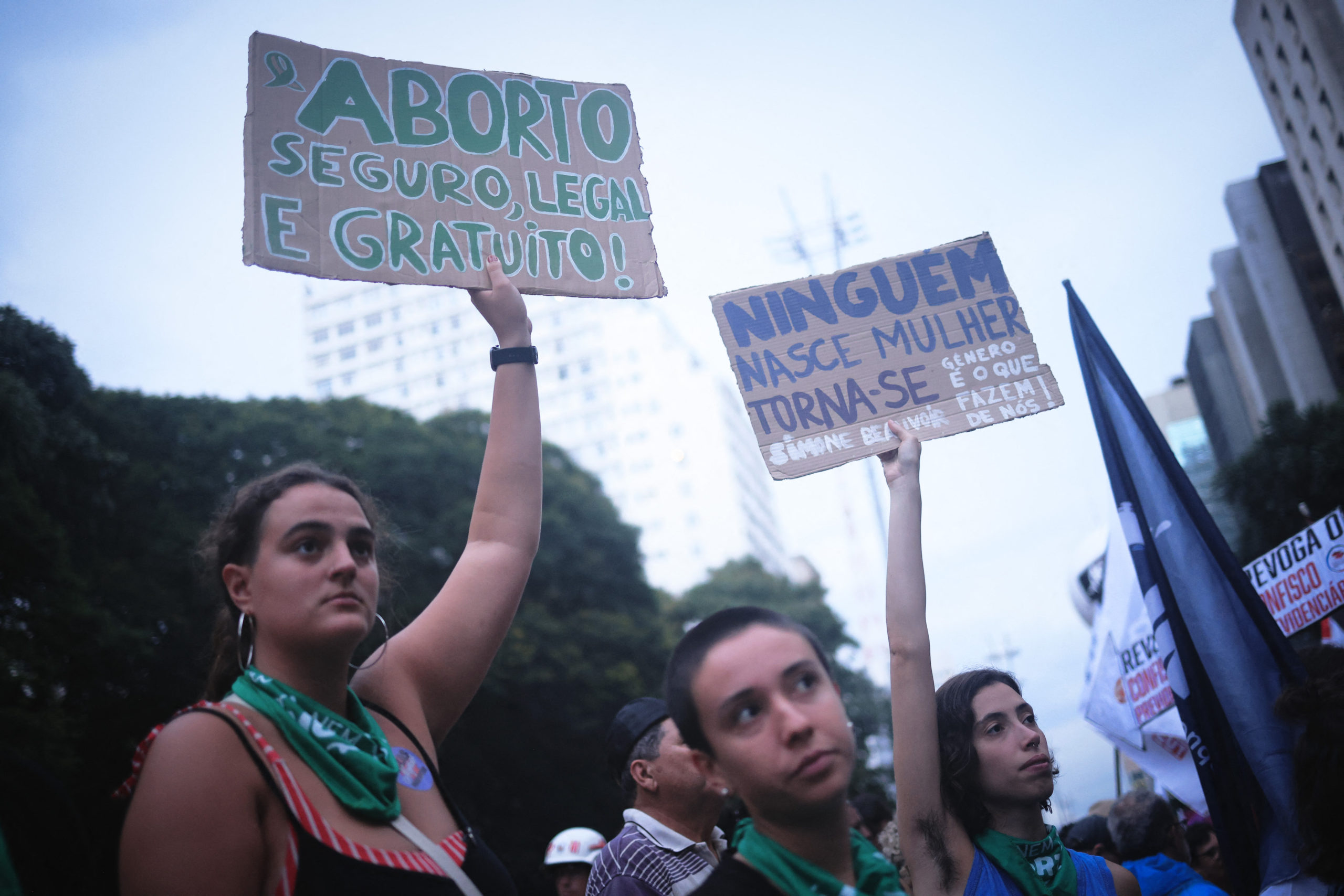 Protester is seen with a sign saying “safe, legal and free abortion” during the International Women's Day march, on Avenida Paulista, region central city of Sao Paulo (Photo by Ettore Chiereguini / AGIF / AGIF via AFP)